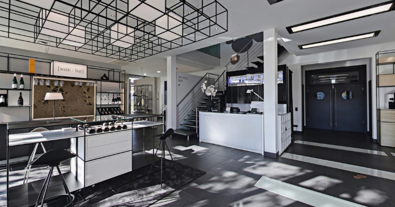 concept-s CAROLINE furnishing system in a modern showroom featuring modular shelving, sales counters and interior solutions for retail, hospitality and commercial environments.